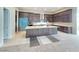 Spacious kitchen boasts a large island, custom cabinets, and stainless steel appliances at 4750 Outlook Peak St, Las Vegas, NV 89135