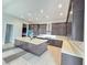 Bright kitchen with large island, sleek appliances, and custom wood cabinetry at 4750 Outlook Peak St, Las Vegas, NV 89135