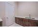 A stylish laundry room with ample counter space and modern cabinetry at 4750 Outlook Peak St, Las Vegas, NV 89135