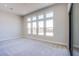 Bright living room with multiple windows offering an abundance of natural light at 4750 Outlook Peak St, Las Vegas, NV 89135