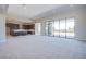 Large living room adjacent to kitchen, filled with natural light and ample space at 4750 Outlook Peak St, Las Vegas, NV 89135