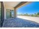 A covered patio with stone pavers, offering an inviting outdoor living space at 4750 Outlook Peak St, Las Vegas, NV 89135