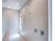 Modern walk-in shower with multiple shower heads and controls at 4750 Outlook Peak St, Las Vegas, NV 89135