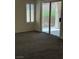 A bedroom featuring a sliding glass door leading to a patio or backyard space at 495 Edgefield Ridge Pl, Henderson, NV 89012