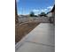 This backyard has a concrete patio and block wall, offering privacy and space for outdoor activities at 5004 Wayfaring Tree Ave, Las Vegas, NV 89131