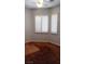 This bedroom has a ceiling fan, carpet floor, baseboards, and two windows with shutters at 5004 Wayfaring Tree Ave, Las Vegas, NV 89131