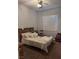 Comfortable bedroom featuring a ceiling fan, shuttered window, and neutral colored walls at 5004 Wayfaring Tree Ave, Las Vegas, NV 89131