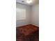 This bedroom has carpet floor, baseboards, and a window with shutters at 5004 Wayfaring Tree Ave, Las Vegas, NV 89131