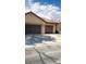 Charming home featuring a three-car garage and well-maintained exterior at 5004 Wayfaring Tree Ave, Las Vegas, NV 89131