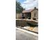 Charming exterior with a well-manicured front yard at 5004 Wayfaring Tree Ave, Las Vegas, NV 89131