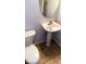 Functional half bathroom with pedestal sink and tile flooring at 5004 Wayfaring Tree Ave, Las Vegas, NV 89131