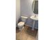 Practical half bathroom with a neutral color scheme and ceramic tile floor at 5004 Wayfaring Tree Ave, Las Vegas, NV 89131