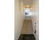 Inviting entryway showcasing a carpeted staircase and stylish tiled flooring at 5256 Harvest Breeze Rd, Las Vegas, NV 89118