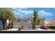 Charming townhome featuring an attached garage and well-maintained landscaping at 5256 Harvest Breeze Rd, Las Vegas, NV 89118