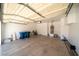Spacious two car garage with white ceiling, water heater, and room for storage at 5256 Harvest Breeze Rd, Las Vegas, NV 89118