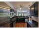 Gourmet kitchen with stainless steel appliances, granite countertops, and open layout for easy entertaining at 5256 Harvest Breeze Rd, Las Vegas, NV 89118