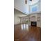 Spacious living room featuring a fireplace, wood floors, and ample natural light at 5256 Harvest Breeze Rd, Las Vegas, NV 89118