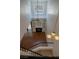 Aerial view of the living room with high ceilings, fireplace, built-in shelving and a staircase at 5256 Harvest Breeze Rd, Las Vegas, NV 89118