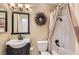 This bathroom features a vintage-inspired sink and fixtures with a shower-tub combo at 5368 Regal Ave, Las Vegas, NV 89146