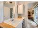 A bathroom features a single sink vanity with decorative textured walls at 5368 Regal Ave, Las Vegas, NV 89146