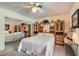 Cozy bedroom features a mirrored closet, ceiling fan, and classic decor at 5368 Regal Ave, Las Vegas, NV 89146