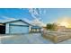 Charming single-story home with an attached two-car garage and a well-maintained front yard at 5368 Regal Ave, Las Vegas, NV 89146