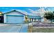 Charming single-story home with an attached two-car garage and a well-maintained front yard at 5368 Regal Ave, Las Vegas, NV 89146