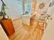 This brightly lit home office offers ample desk space and stylish wood flooring at 5368 Regal Ave, Las Vegas, NV 89146
