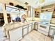 Well-lit kitchen with stylish countertops, white appliances, and an open layout at 5368 Regal Ave, Las Vegas, NV 89146