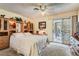 Bright main bedroom with patio access, ceiling fan, and dresser at 5368 Regal Ave, Las Vegas, NV 89146