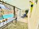 Charming covered patio area with poolside seating, decor and a tranquil lounge area, perfect for relaxation and enjoying outdoors at 5368 Regal Ave, Las Vegas, NV 89146