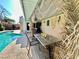 Inviting covered patio area with dining, decor and relaxing poolside views at 5368 Regal Ave, Las Vegas, NV 89146
