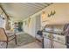Charming covered patio with dining table, grill, and nautical decor at 5368 Regal Ave, Las Vegas, NV 89146