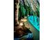 Backyard pool and palm trees, accented by outdoor lighting at 5368 Regal Ave, Las Vegas, NV 89146