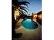 This backyard includes a sparkling pool and outdoor ladder at 5368 Regal Ave, Las Vegas, NV 89146