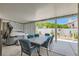 Inviting covered patio area with dining set and hot tub, perfect for relaxation and entertainment at 5489 Royal Vista Ln, Las Vegas, NV 89149