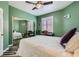 Green-painted bedroom featuring a mirrored closet and a window with shutters at 5489 Royal Vista Ln, Las Vegas, NV 89149