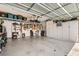 Spacious garage with ample storage cabinets and organization for tools and equipment at 5489 Royal Vista Ln, Las Vegas, NV 89149