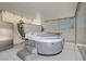 Covered hot tub for relaxation and entertainment, complemented by a stainless steel refrigerator at 5489 Royal Vista Ln, Las Vegas, NV 89149