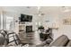 Inviting living room with fireplace, stylish flooring, and an open layout that leads to the dining area at 5489 Royal Vista Ln, Las Vegas, NV 89149