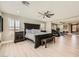 Large main bedroom features a ceiling fan, natural light, and a dedicated exercise area at 6103 Sundown Crest St, Las Vegas, NV 89113