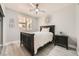 Clean bedroom with a ceiling fan, neutral paint, and natural light streaming through window at 6103 Sundown Crest St, Las Vegas, NV 89113