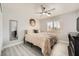 Comfortable bedroom with a neutral color palette, updated ceiling fan, and natural light at 6103 Sundown Crest St, Las Vegas, NV 89113