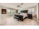 Spacious bedroom featuring large bed, plantation shutters, and modern decor at 6103 Sundown Crest St, Las Vegas, NV 89113