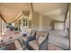 Spacious covered patio features neutral decor, ceiling fans, and tile flooring, with backyard views at 6103 Sundown Crest St, Las Vegas, NV 89113