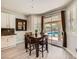 Cozy dining area with access to the backyard pool through sliding glass doors at 6103 Sundown Crest St, Las Vegas, NV 89113