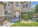 Welcoming front entrance with a white door, stone walkway, and verdant landscaping at 6103 Sundown Crest St, Las Vegas, NV 89113