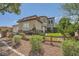 Inviting two-story home with stone accents and a well-manicured front yard at 6103 Sundown Crest St, Las Vegas, NV 89113