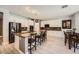 Bright kitchen featuring granite counters, stainless appliances, and a cozy dining area at 6103 Sundown Crest St, Las Vegas, NV 89113