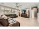 Spacious living room with large windows, ceiling fan, recessed lights, and contemporary decor at 6103 Sundown Crest St, Las Vegas, NV 89113